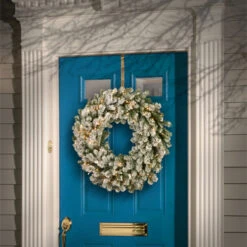 Christmas Central Pre-Lit Snowy Sheffield Spruce Artificial Christmas Wreath, 24-Inch, White LED Lights -Northlight Shop dnat pesl3 307 24w b 2 81772.1665087475